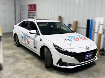This vehicle is shown in our shop with custom vinyl decals installed by the Atlas Wrap Co team.
