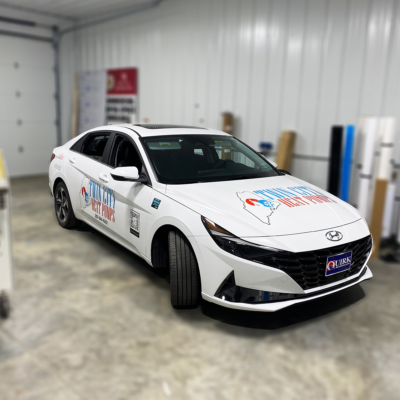This vehicle is shown in our shop with custom vinyl decals installed by the Atlas Wrap Co team.