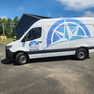 A side view of the True North Energy Services work van with custom vinyl decals printed and installed by Atlas Wrap Co.