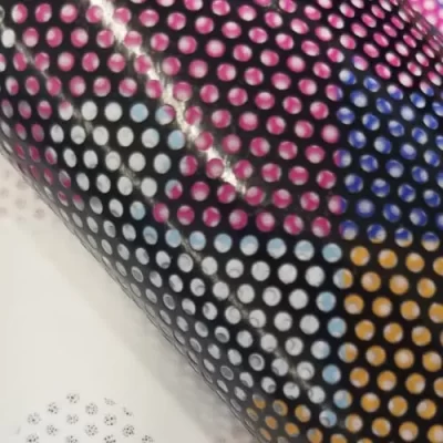 A close up detail of perforated window vinyl material.